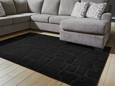 Gibbswell Washable 5' x 7' Area Rug - Dow Furniture (ME)