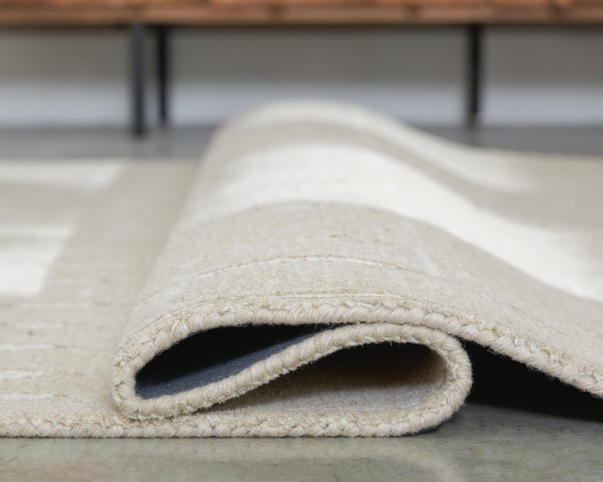 Wolbert 7'8" x 10' Area Rug - Dow Furniture (ME)