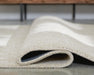 Wolbert 7'8" x 10' Area Rug - Dow Furniture (ME)